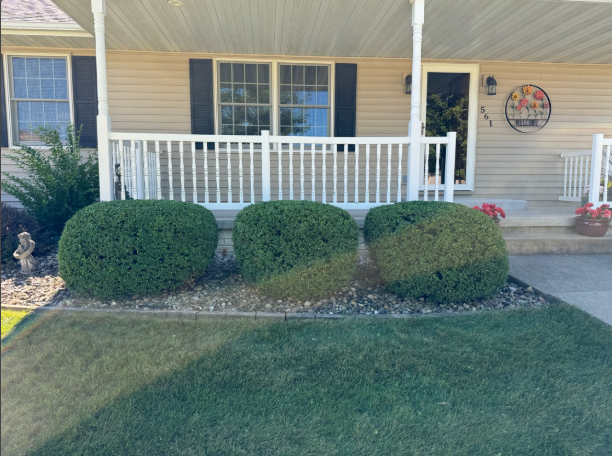 Front porch with professional landscaping and rock beds by BDS Lawns