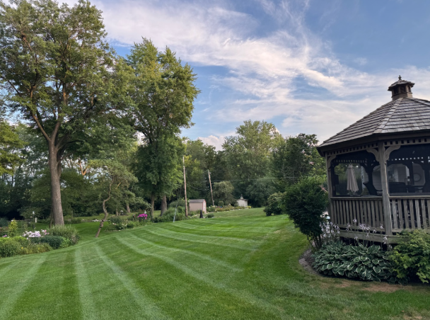 Beautiful property with gazebo and professional mowing stripes by BDS Lawns